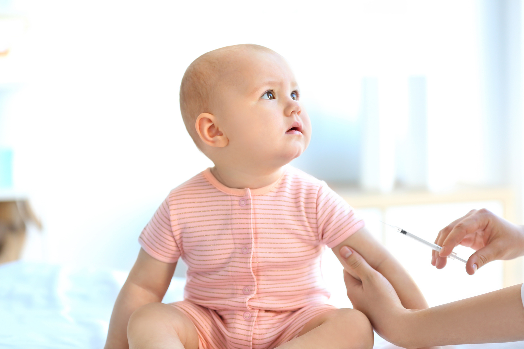 Doctor Vaccinating Baby in Clinic